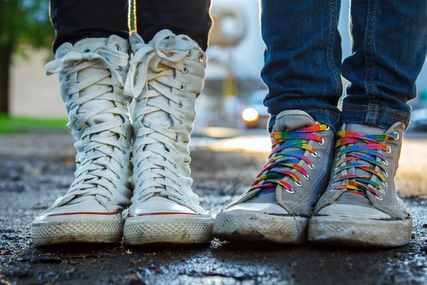 Two persons zoomed gumshoes — Stock Photo, Image