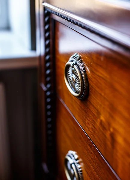 Antique cupboard in front of window — Stock Photo, Image
