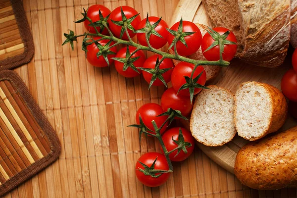 Tomatoes and bread — Stock Photo, Image