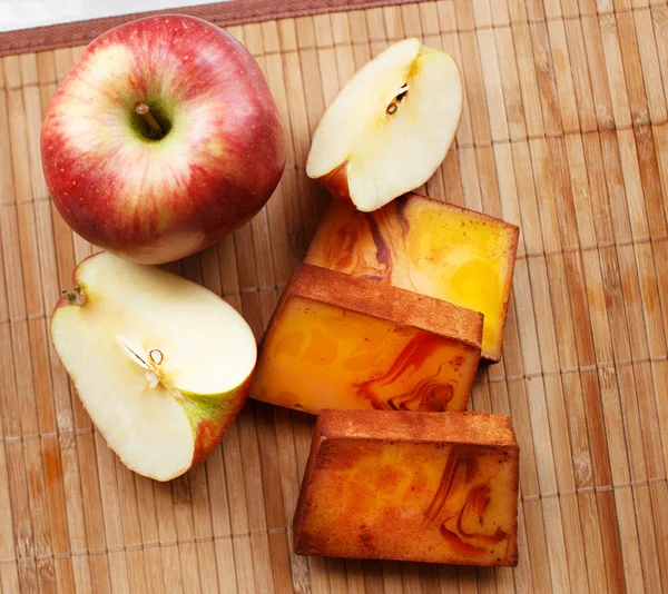 Red composition of apple and soap — Stock Photo, Image