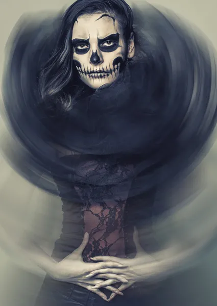 Sinister girl with a skull makeup — Stock Photo, Image