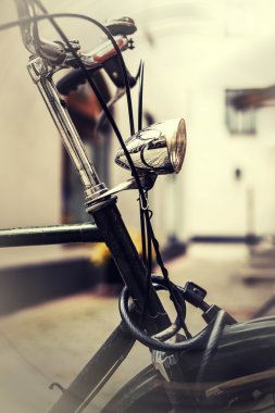 Vintage photo of a bike lamp clipart
