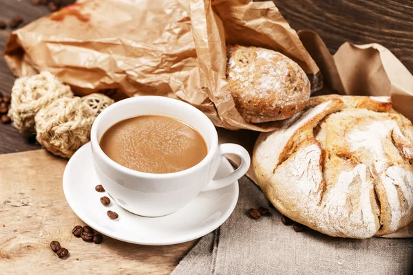Milk coffee and homemade loaves of bread — Stock Photo, Image