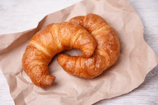 Two croissants on eco paper — Stock Photo, Image