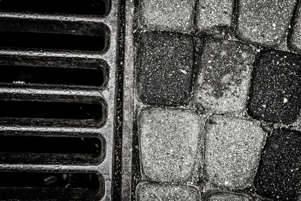 Drainage well closeup in black and white — Stock Photo, Image