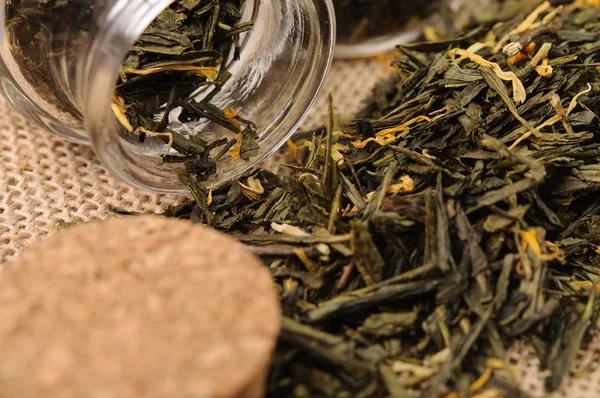 Green tea and a cork closeup — Stock Photo, Image