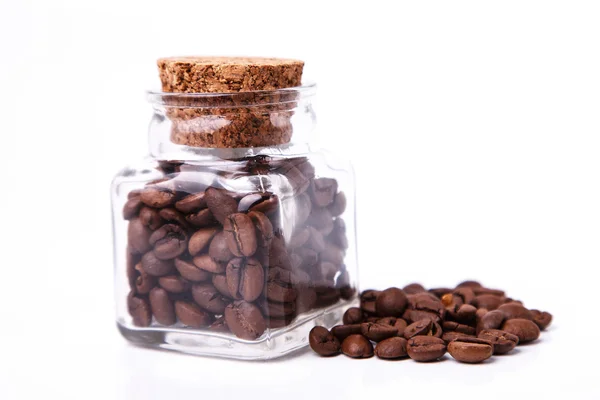 Coffee beans in a tiny glass jar — Stock Photo, Image