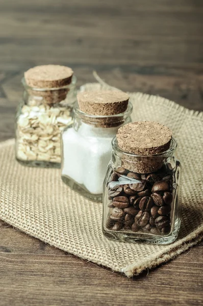 Drie potten met koffie, suiker en haver — Stockfoto