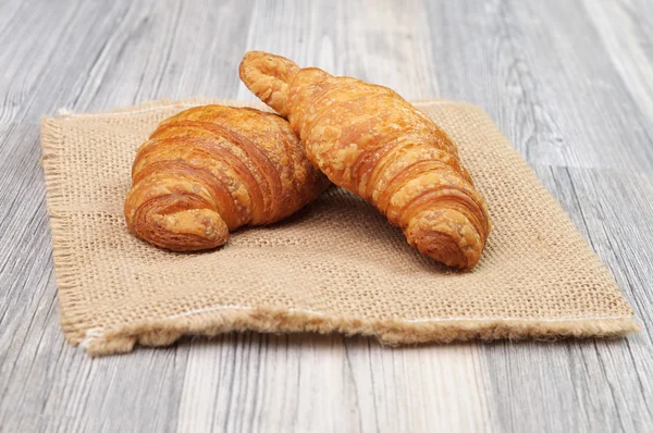 Two organic pastry rolls on a cloth — Stock Photo, Image