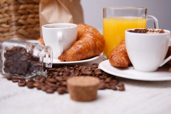 Composition of croissants, coffee and orange juice