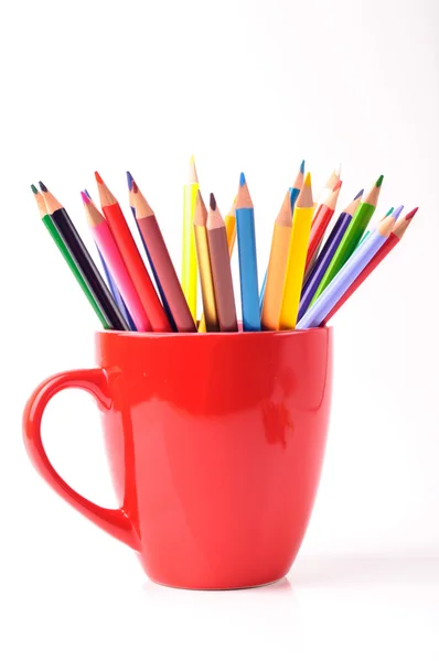 Color pencils in a red mug — Stock Photo, Image