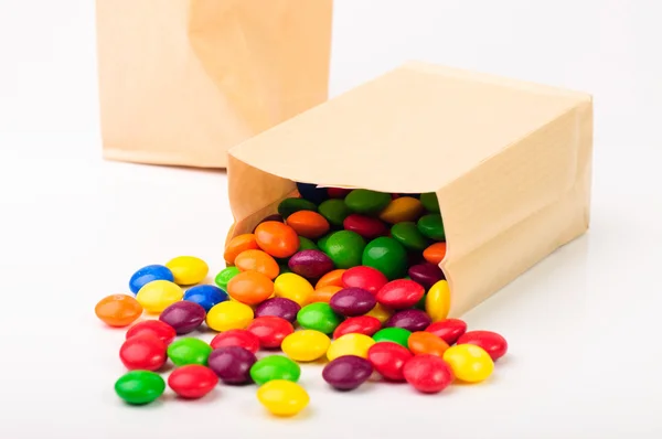 Two paper bags with color candies — Stock Photo, Image