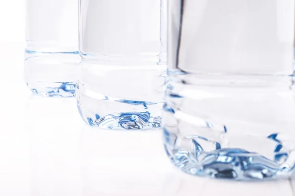 Fondo de tres botellas de pie en una fila — Foto de Stock