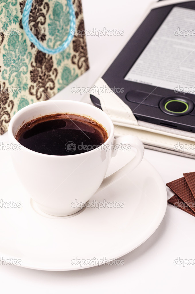 A cup of coffee and a tablet pc