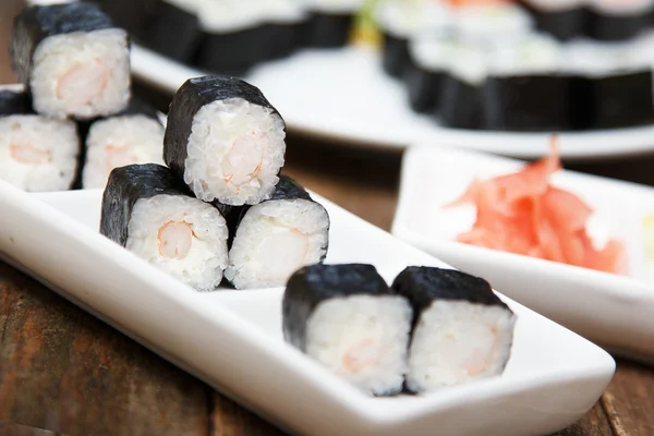 Shrimp sushi with ginger on a plate — Stock Photo, Image