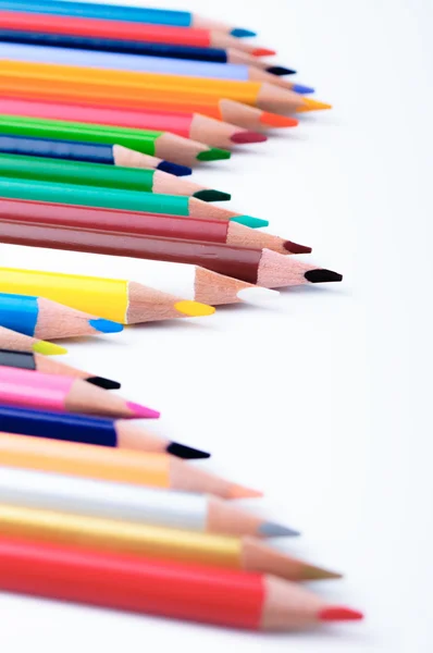 Multicolor pencils on a white surface — Stock Photo, Image