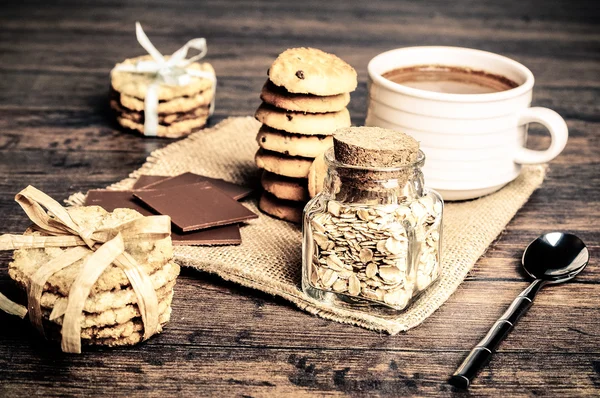 A loaf of crusty bread and a jar of oats — Stock Photo, Image