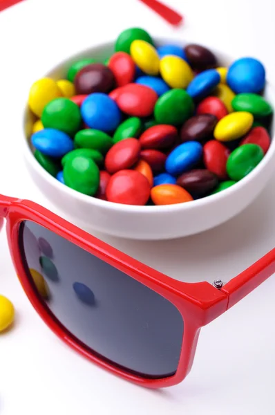 Candies and sunglasses — Stock Photo, Image