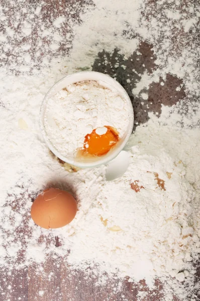 A loaf of crusty bread and a jar of oats — Stock Photo, Image