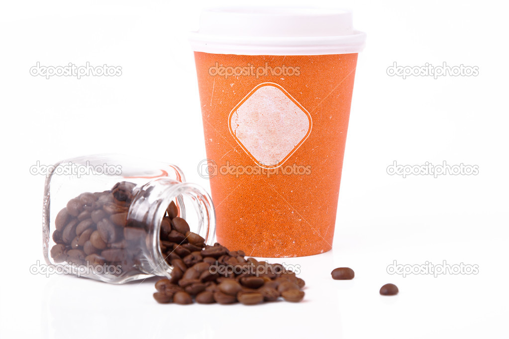 An orange takeout cup and coffee beans in a jar