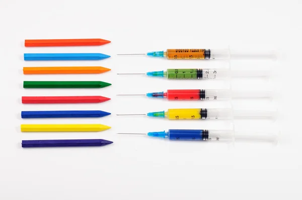Colorful syringes with more crayons — Stock Photo, Image