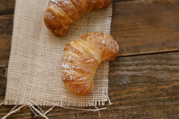 Two croissants on a linen cloth — Stock Photo, Image