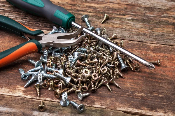 Screwdriver and pliers — Stock Photo, Image