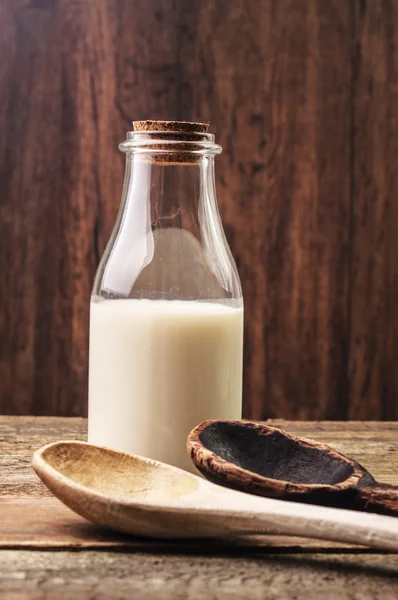 Spoons and milk — Stock Photo, Image