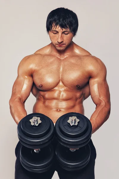 Man with dumbbells — Stock Photo, Image