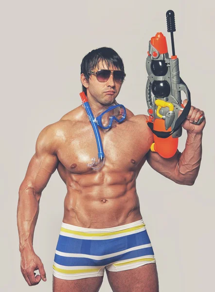 Man with water gun — Stock Photo, Image