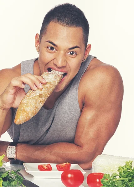 Homem comendo pão — Fotografia de Stock