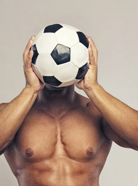 Muscle man with ball — Stock Photo, Image