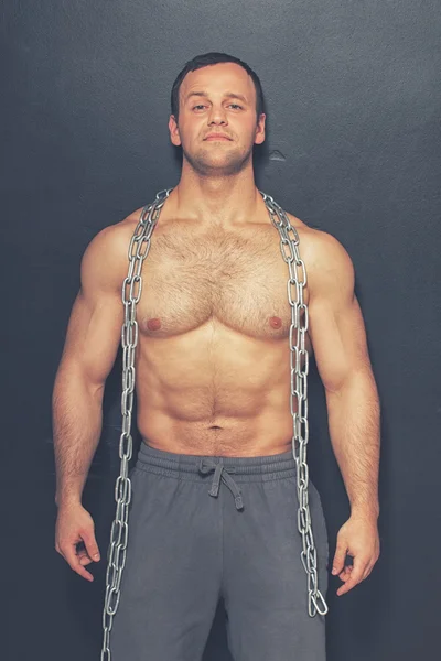 Strong man with chain — Stock Photo, Image