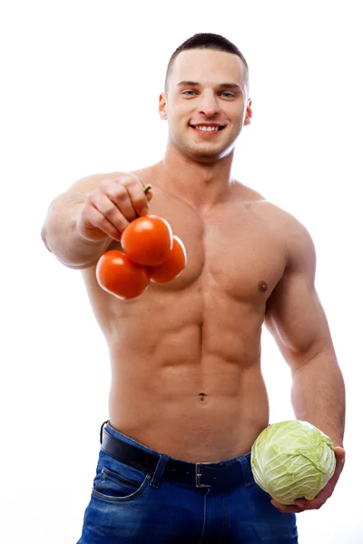 Topless man with tomatoes and a cabbage — Stock Photo, Image