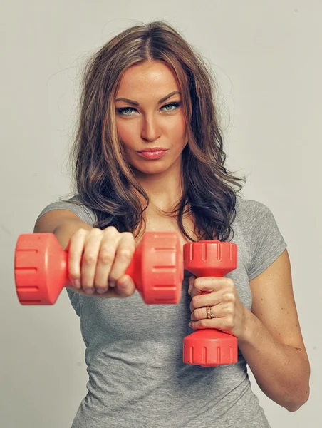 Girl with dumbbells — Stock Photo, Image