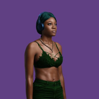 Sexy african woman with naked torso against colorful background