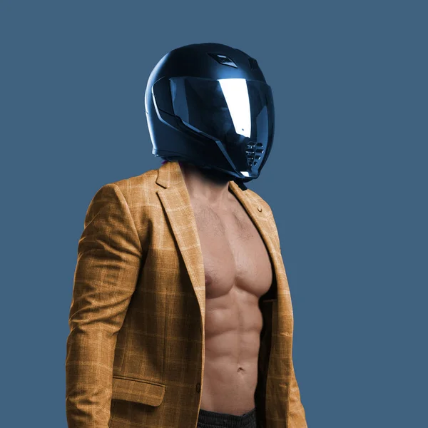 Handsome man with motorcycle helmet posing against blue background — ストック写真