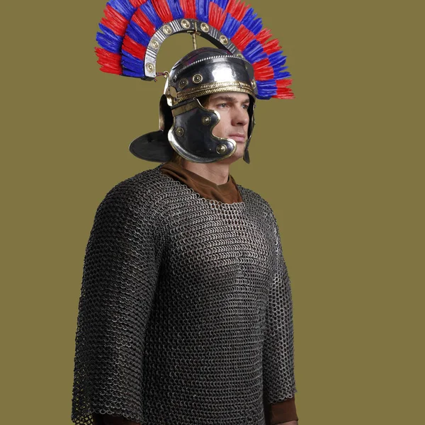 Military man dressed in chain mail posing against colorful background — Φωτογραφία Αρχείου