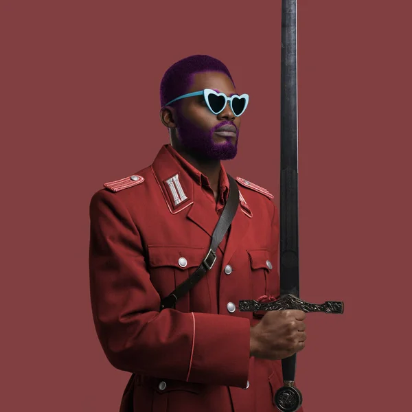 Military african man with weapon posing against colorful background — Stock Fotó