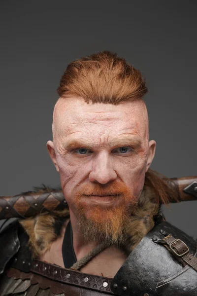 Headshot of viking with scar holding axe on his shoulder — Stock Photo, Image