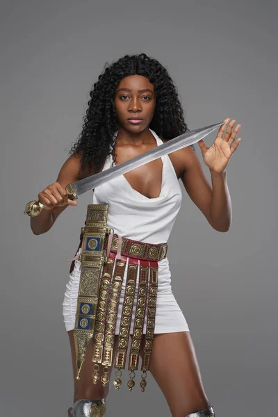 Attractuve black woman dressed like roman warrior — Stock Photo, Image