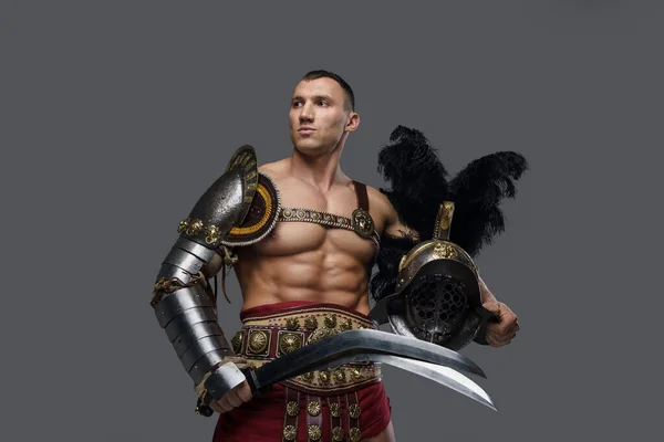 Muscular greek gladiator with plumed helmet and short sword — Stock Photo, Image