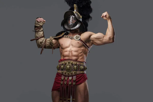 Strong antique gladiator with naked torso isolated on gray background — стоковое фото