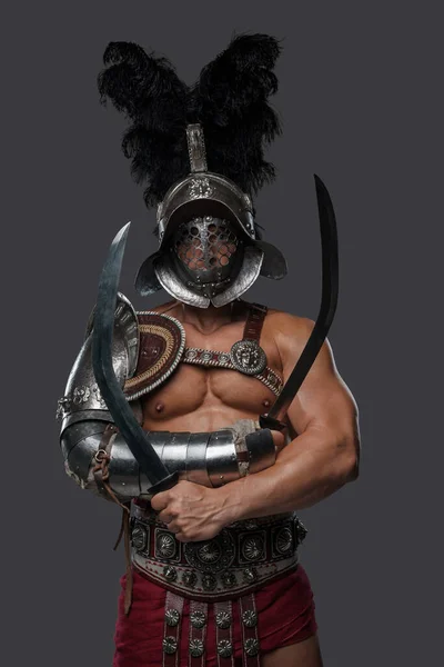 Roman arena fighter with crossed swords and plumed helmet — Stock Photo, Image