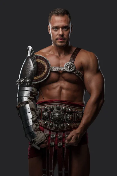 Muscular gladiator with naked torso staring at camera — Foto de Stock