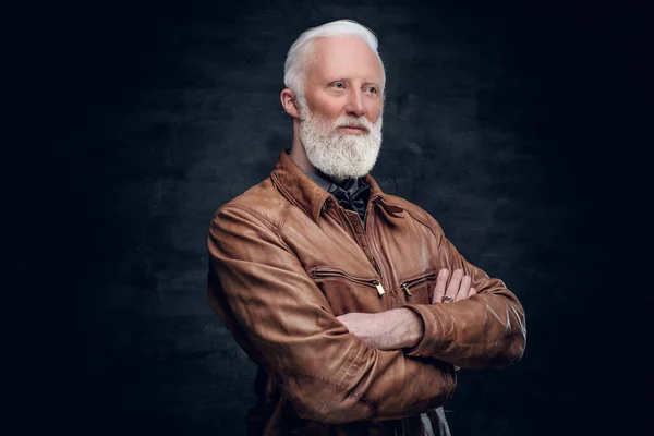 Confident elderly man dressed in brown leather jacket — Photo