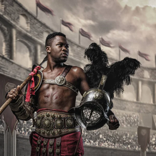 Portrait Victorious Gladiator African Ethnic Holding Plumed Helmet Spear Coliseum — ストック写真