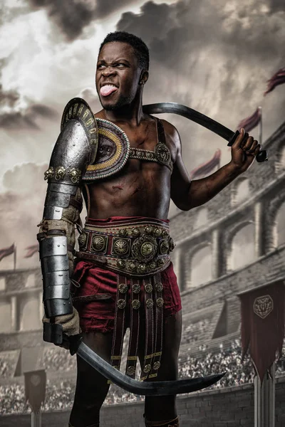 Shot Funny African Gladiator Holding Two Swords Showing His Tongue — ストック写真