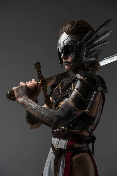 Attractive Valkyrie Make Holding Sword Her Shoulder Grey Background — Zdjęcie stockowe