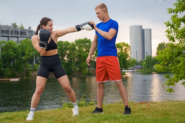 Shot Young Female Boxer Working Out Her Personal Trainer Outdoors — 스톡 사진
